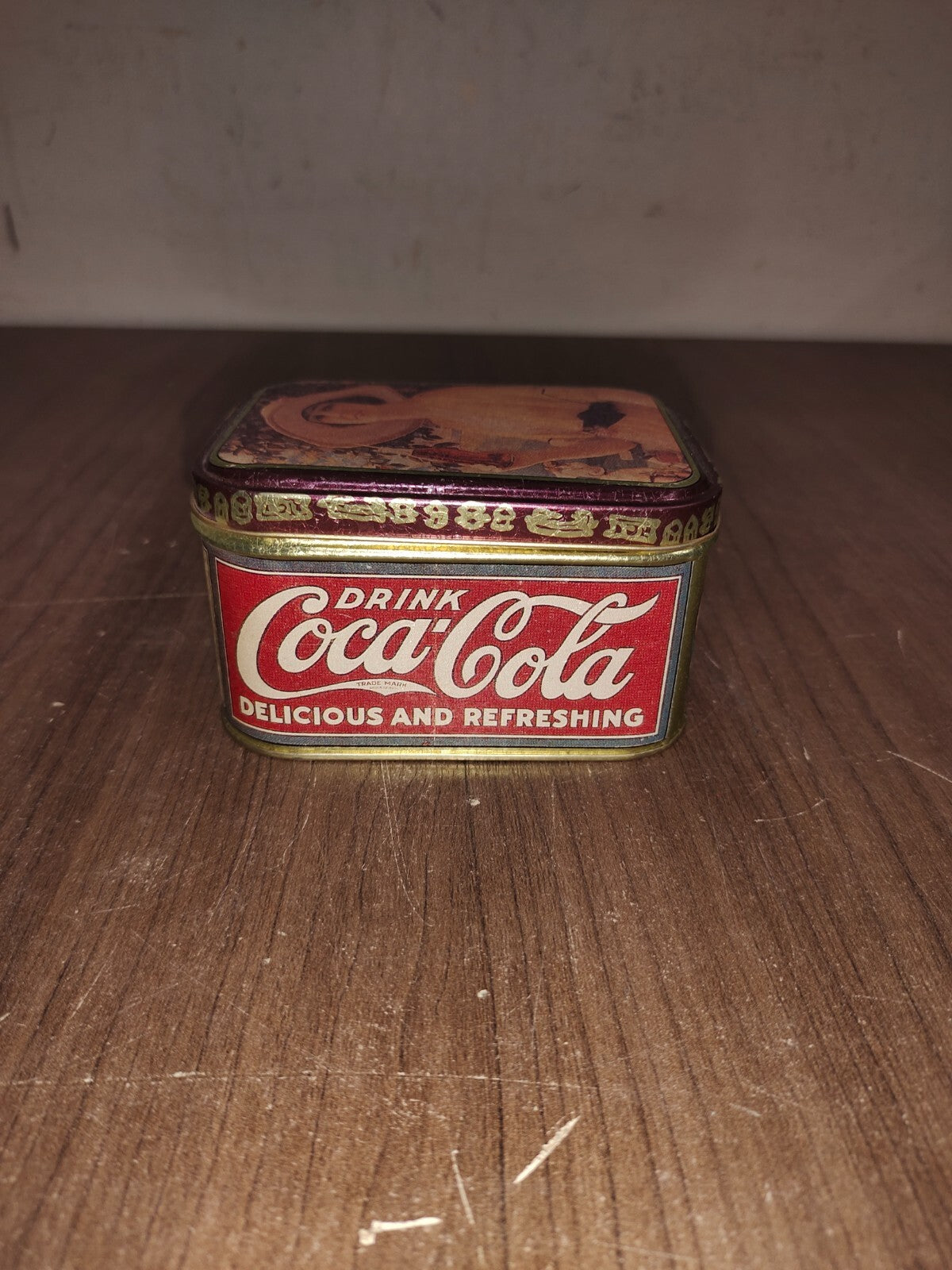 1988 Coca Cola Tin with Lid - Lady with Big Hat holding a Bottle of Coke 4"X2.5"
