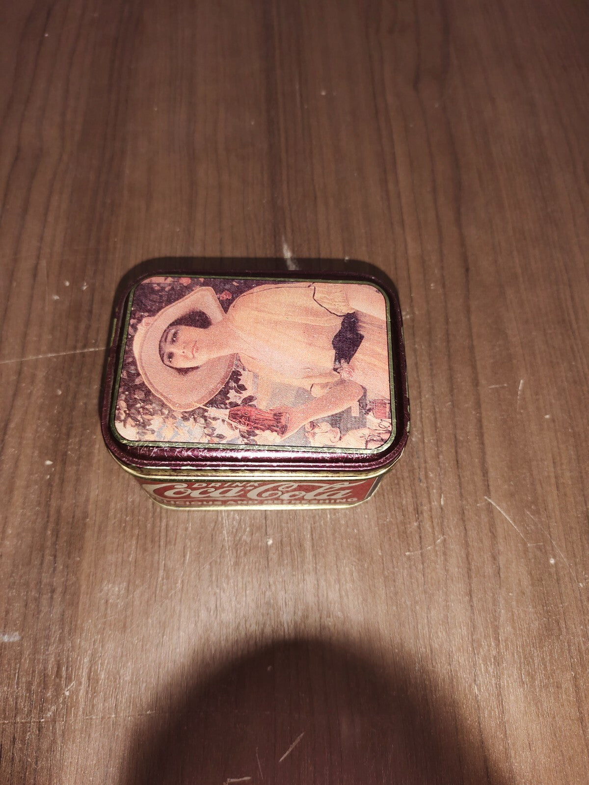 1988 Coca Cola Tin with Lid - Lady with Big Hat holding a Bottle of Coke 4"X2.5"