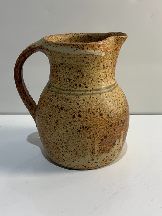 A vintage Handmade pottery jug