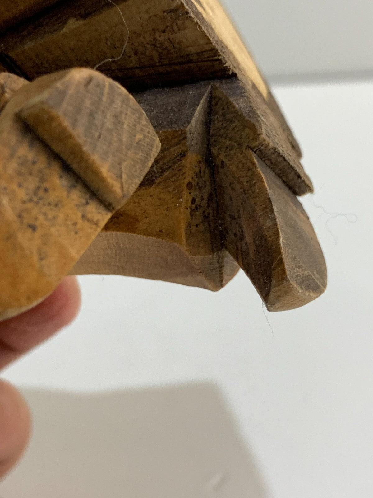 Hand carved old man sitting on a chair