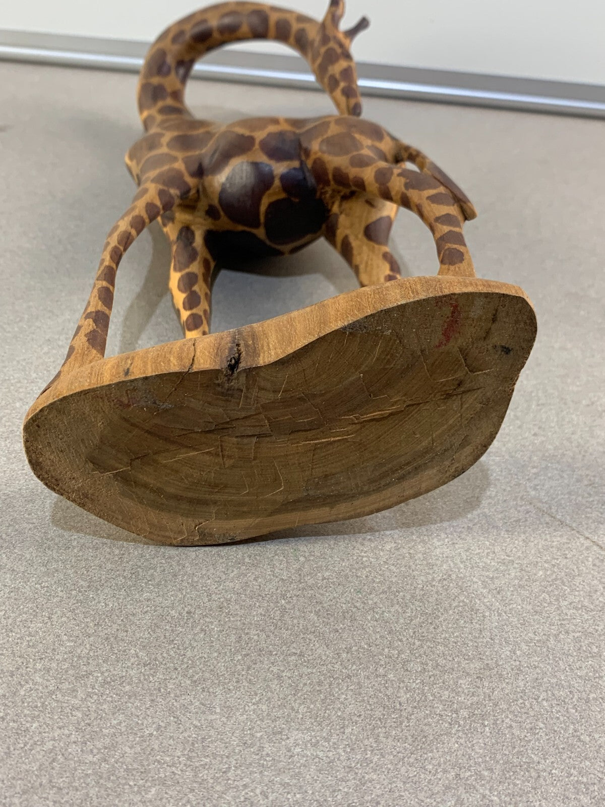 Hand carved and painted 13" wooden giraffe.