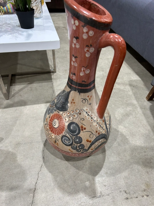 Hand-painted Talavera-style ceramic pitcher