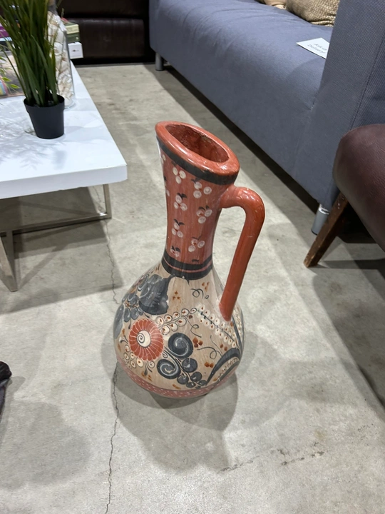 Hand-painted Talavera-style ceramic pitcher