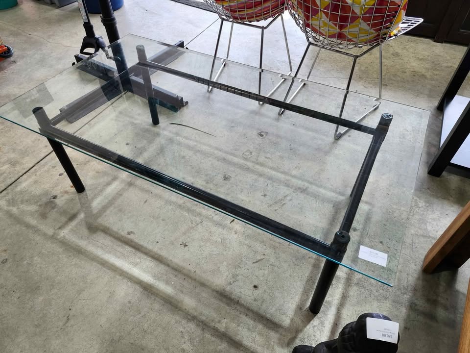 Glass top coffee table with black metal frame