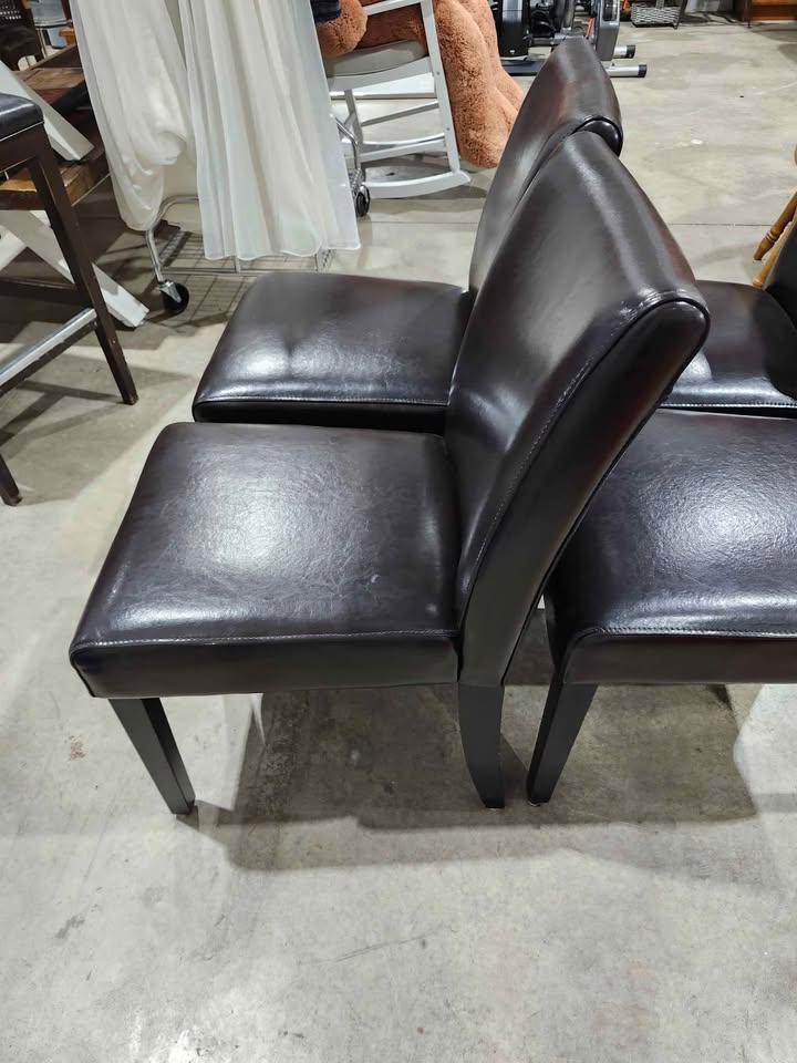 Four Brown Leather Dining Chairs