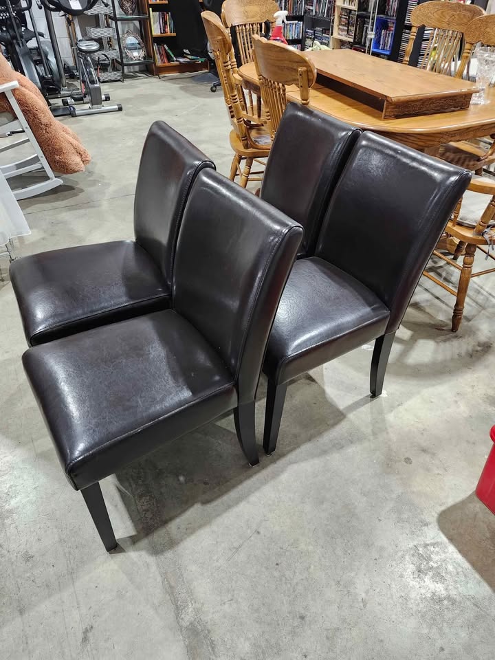 Four Brown Leather Dining Chairs