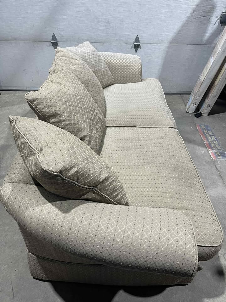 Sofa and armchair with throw pillows