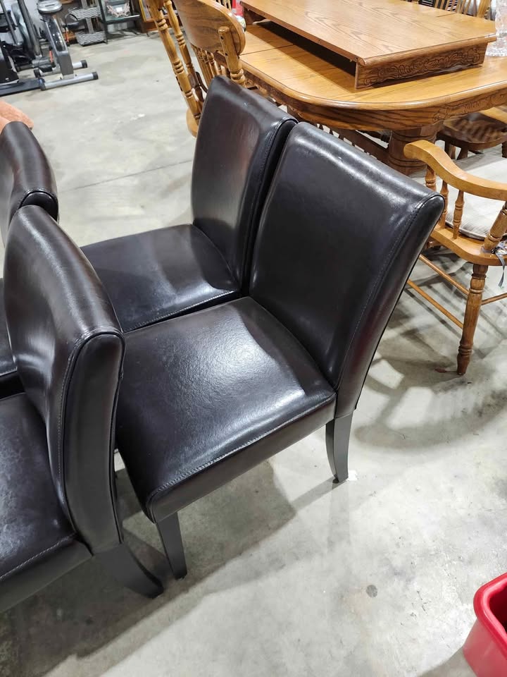 Four Brown Leather Dining Chairs