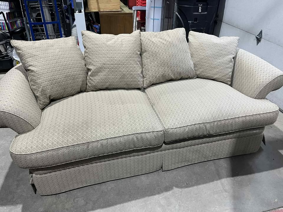 Sofa and armchair with throw pillows