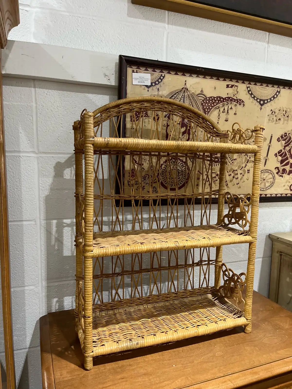 vintage three-tiered rattan bookcase or shelf