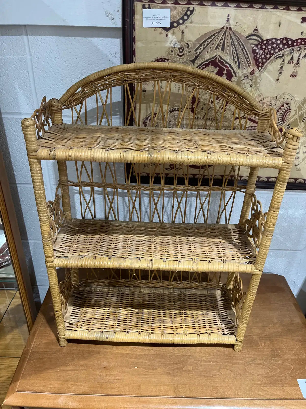 vintage three-tiered rattan bookcase or shelf