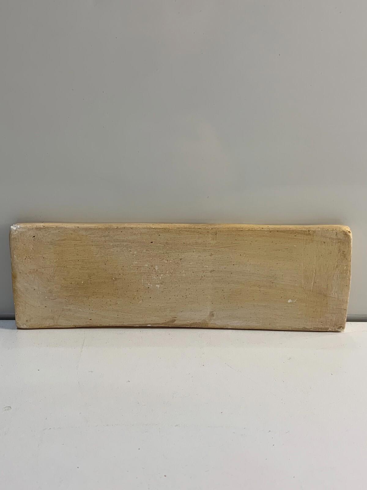 Grès sculpté. Œuvre encadrée