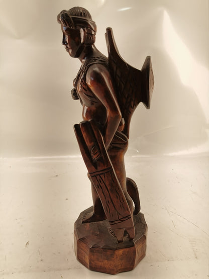 Carving of indigenous man, carved in noble woods.