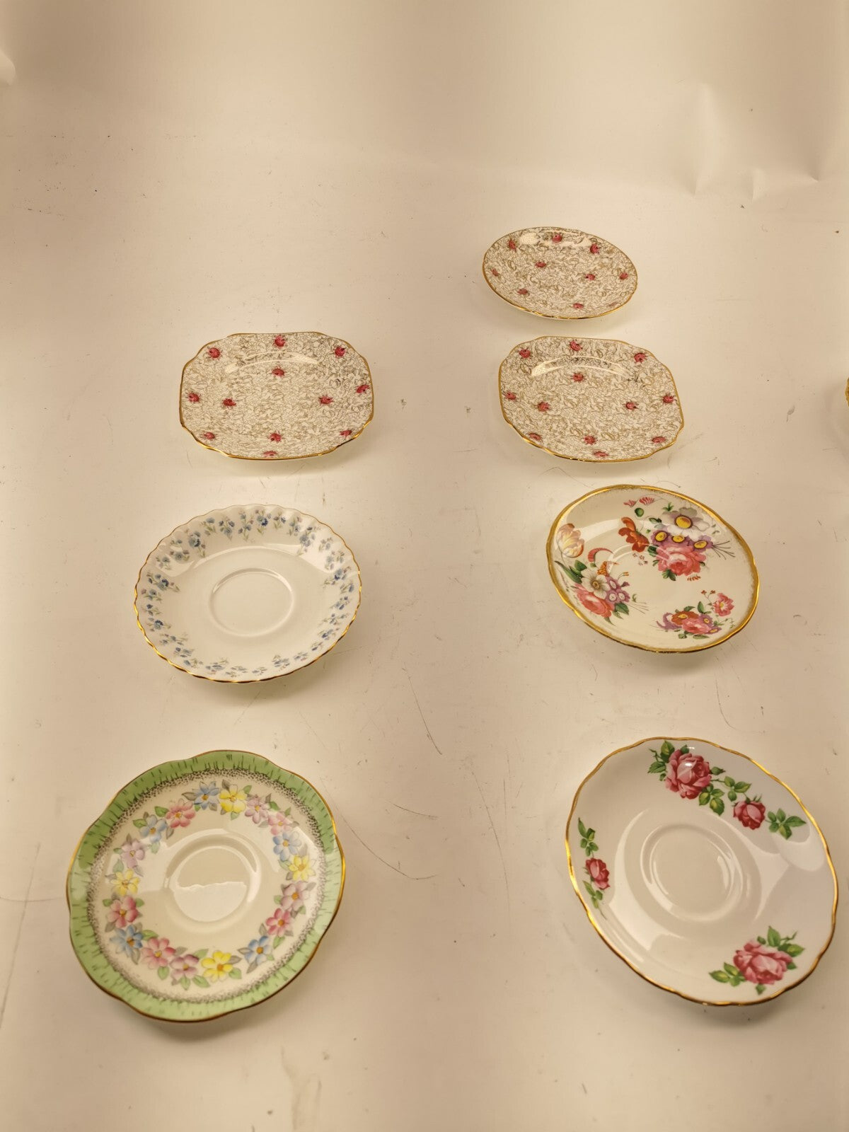 Assorted bone china set 4 cups and 10 saucers. Made in England/Japan/China