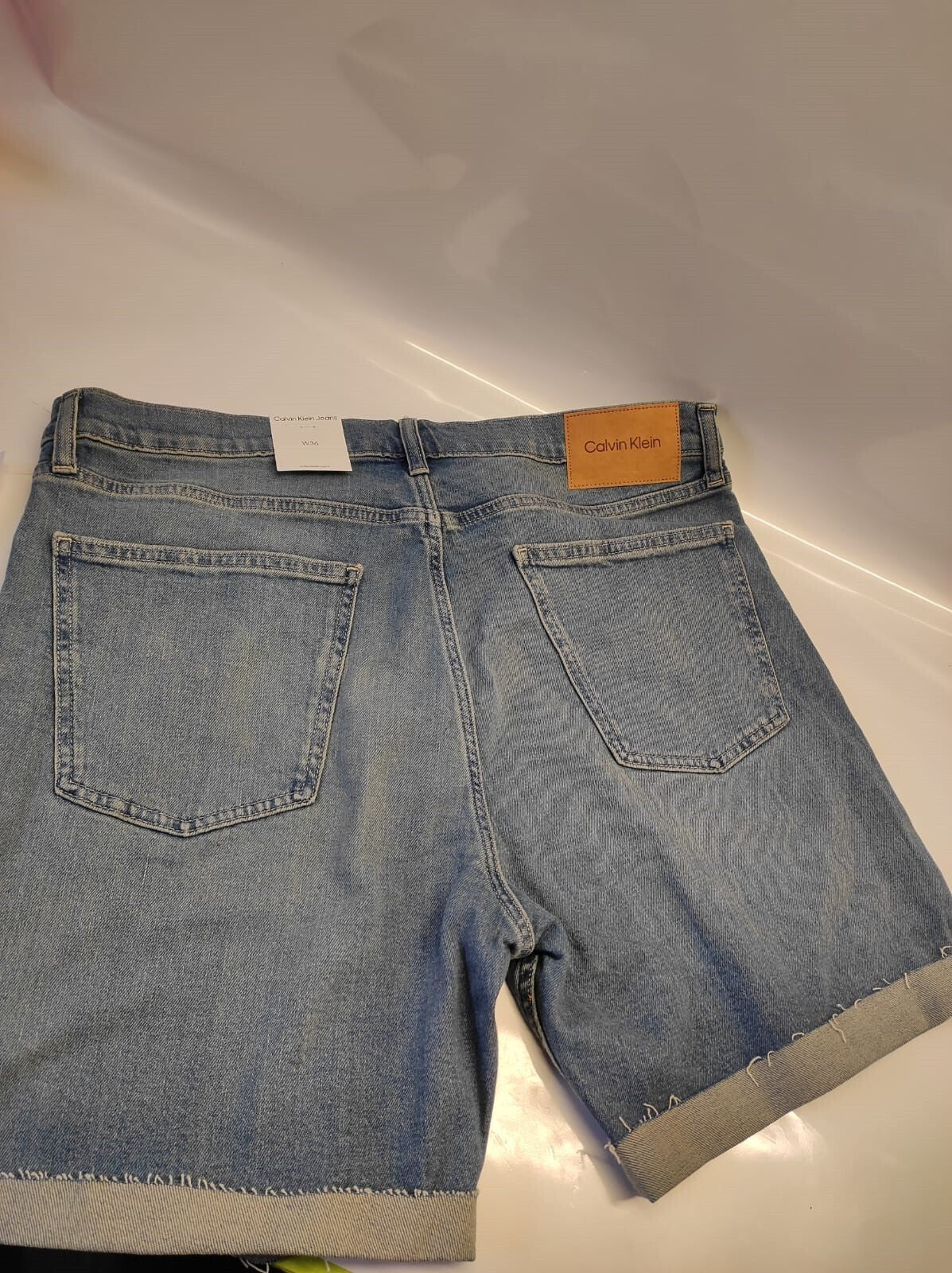 Calvin Klein Mens 36" Cut-Off Denim Shorts