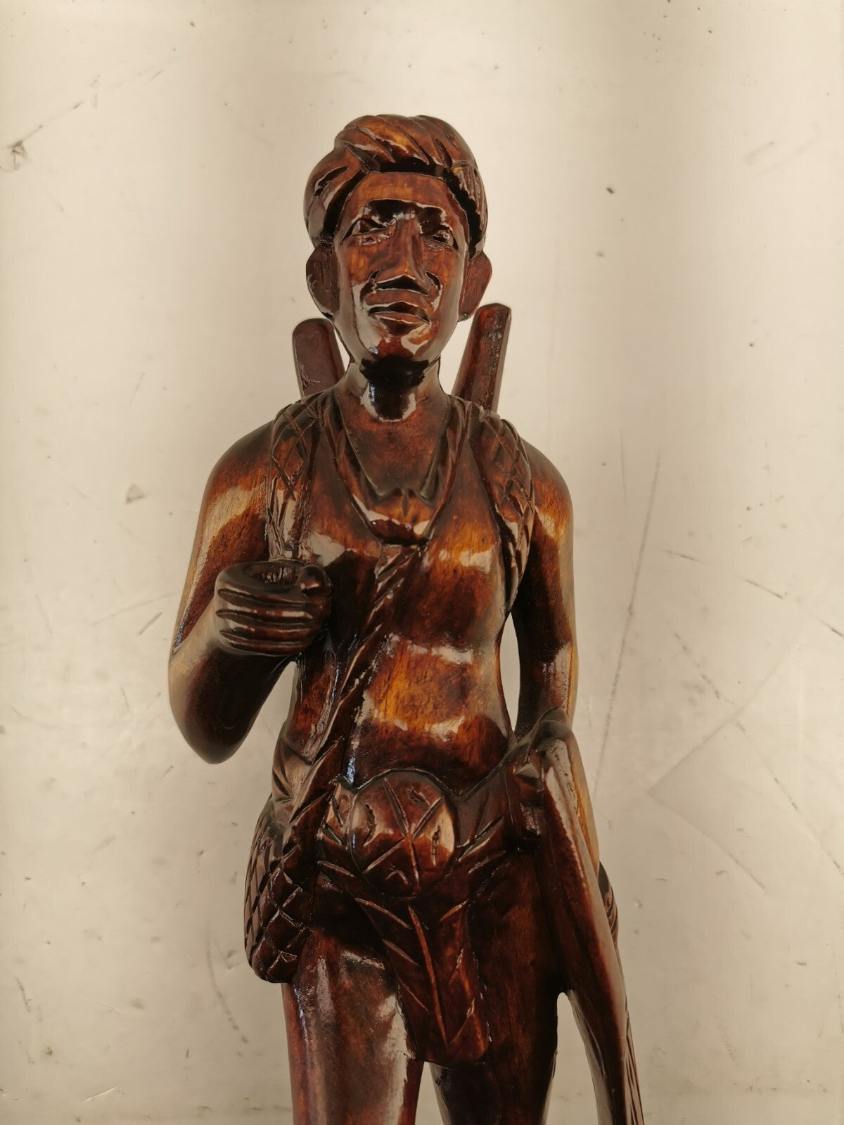 Carving of indigenous man, carved in noble woods.