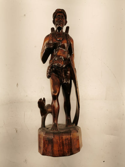 Carving of indigenous man, carved in noble woods.