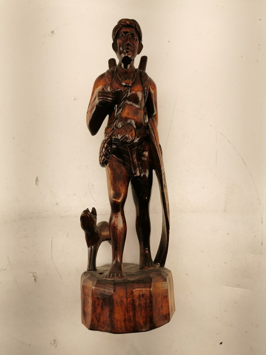 Carving of indigenous man, carved in noble woods.