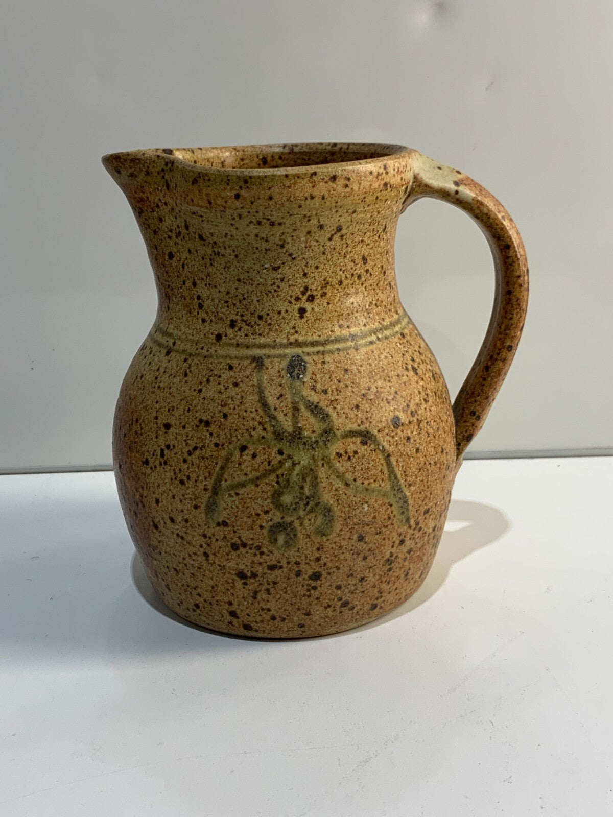A vintage Handmade pottery jug