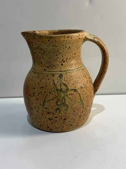 A vintage Handmade pottery jug