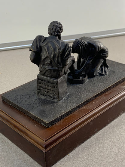 Bronze statue of Jesus washing the feet of Peter, at the last Supper.