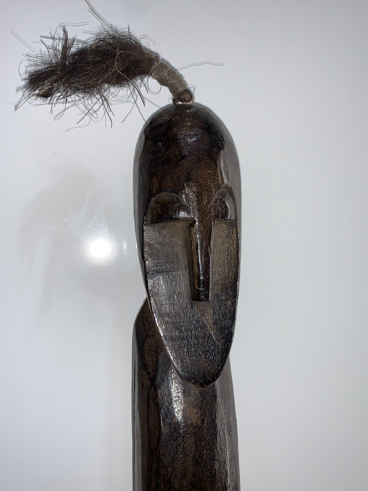 An African Carved Wood Seating Figure