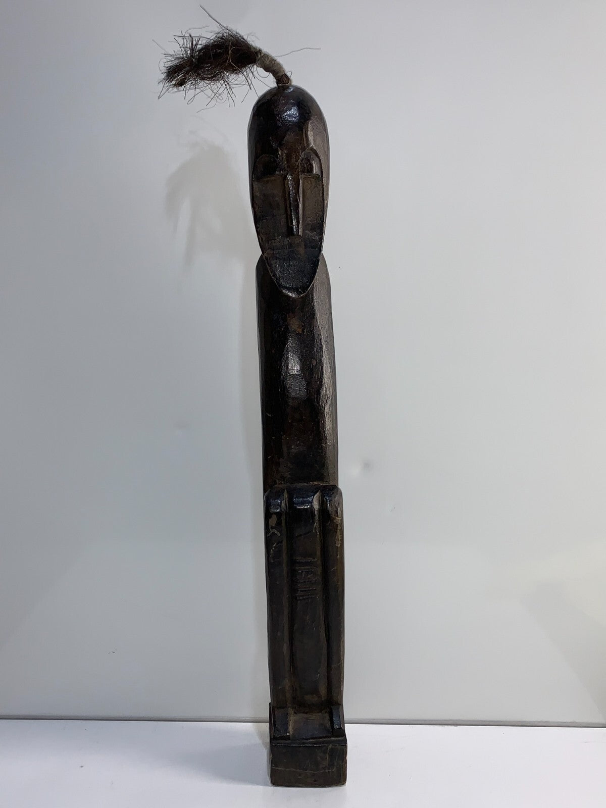 An African Carved Wood Seating Figure