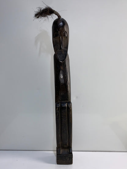 An African Carved Wood Seating Figure