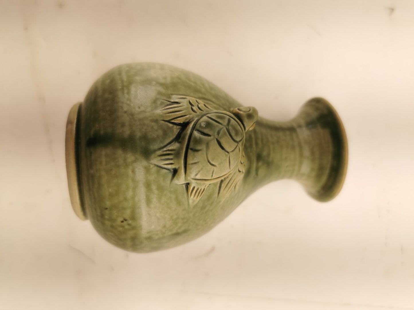 Green vase with a turtle