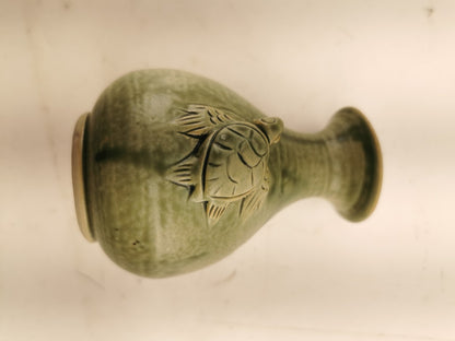 Green vase with a turtle