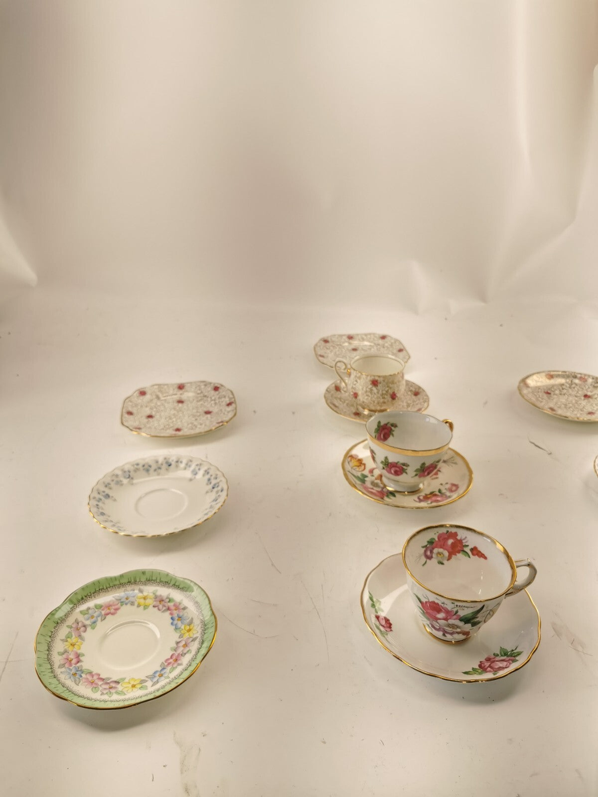 Assorted bone china set 4 cups and 10 saucers. Made in England/Japan/China