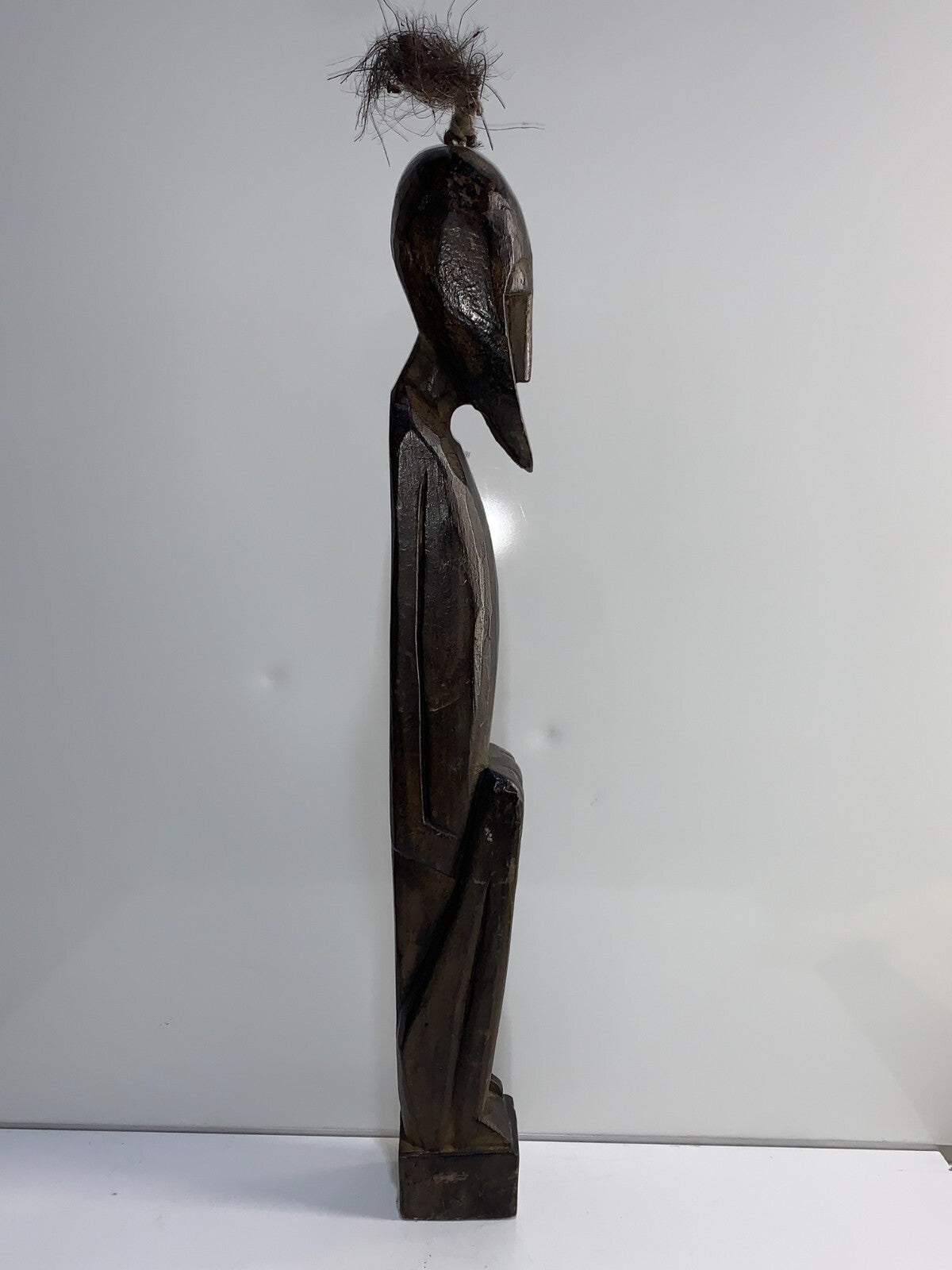An African Carved Wood Seating Figure