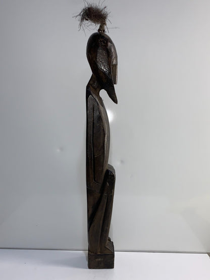 An African Carved Wood Seating Figure