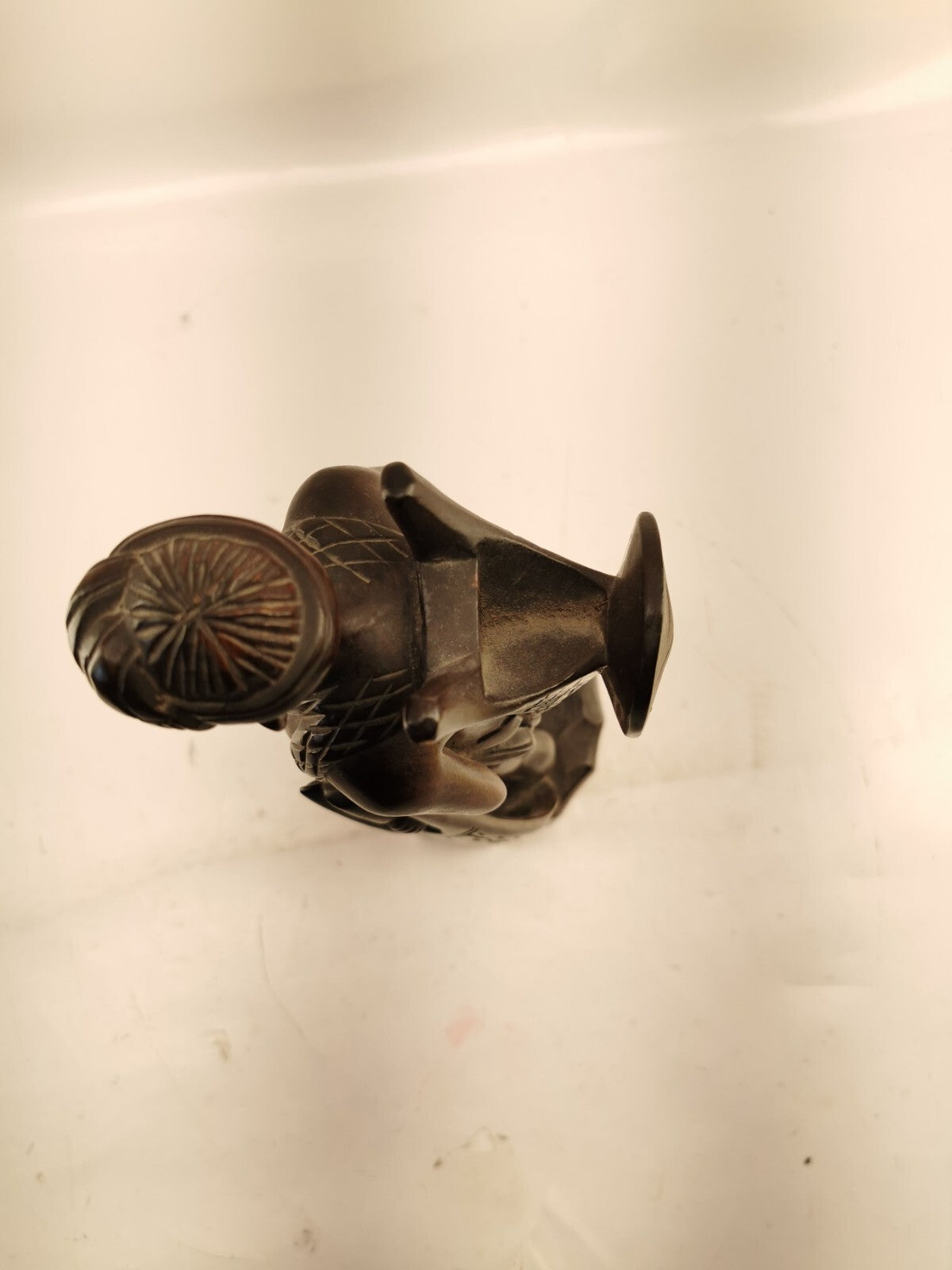 Carving of indigenous man, carved in noble woods.