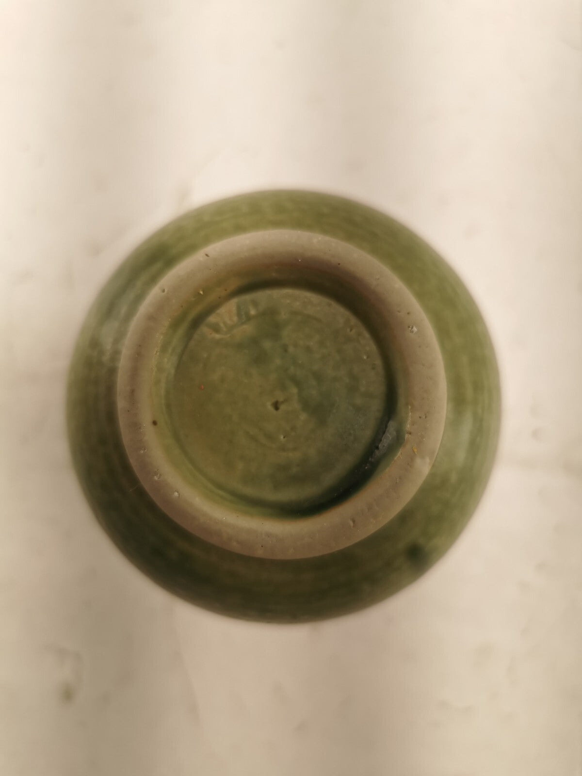 Green vase with a turtle