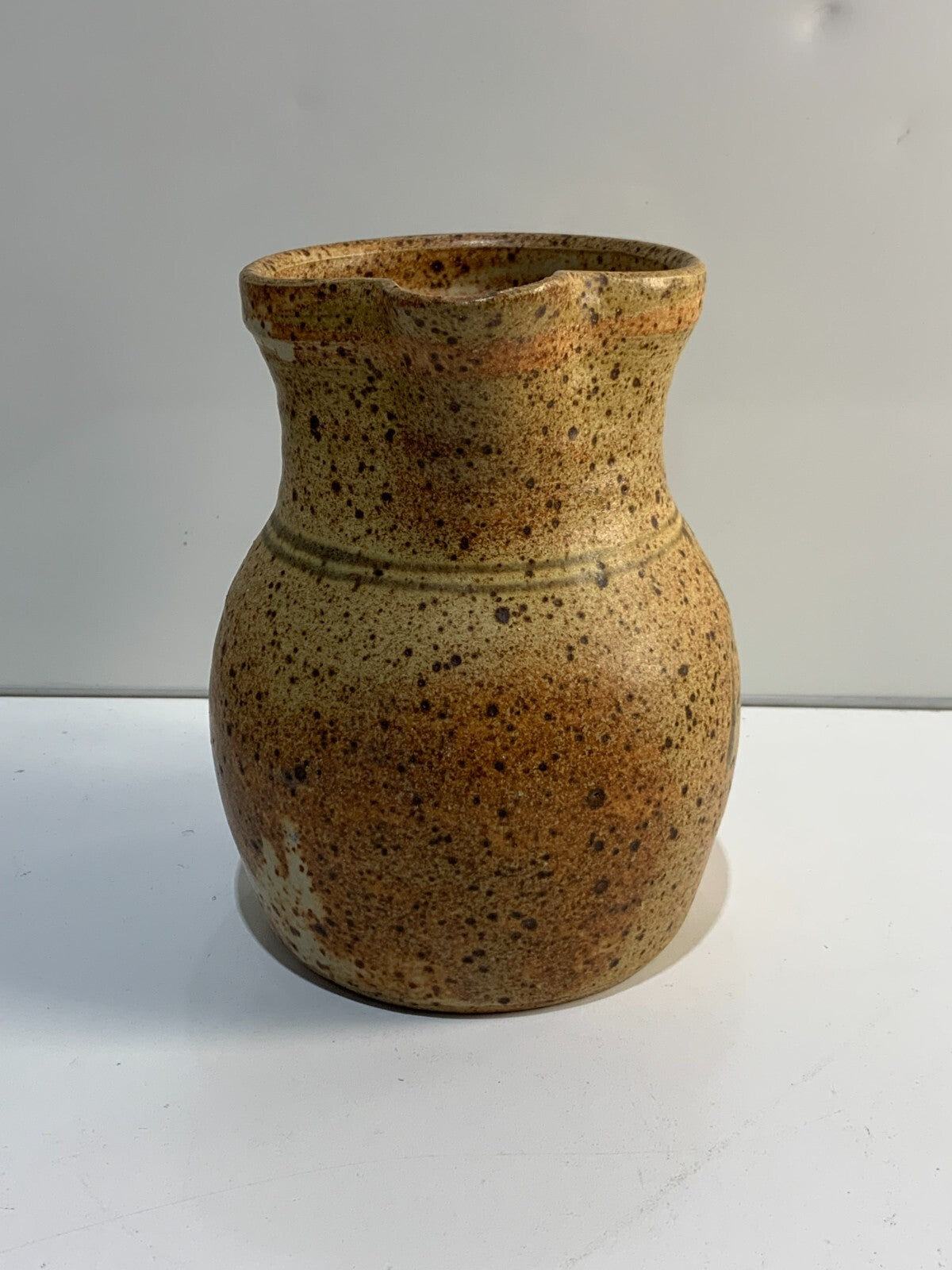 A vintage Handmade pottery jug