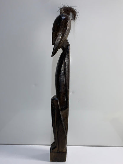 An African Carved Wood Seating Figure