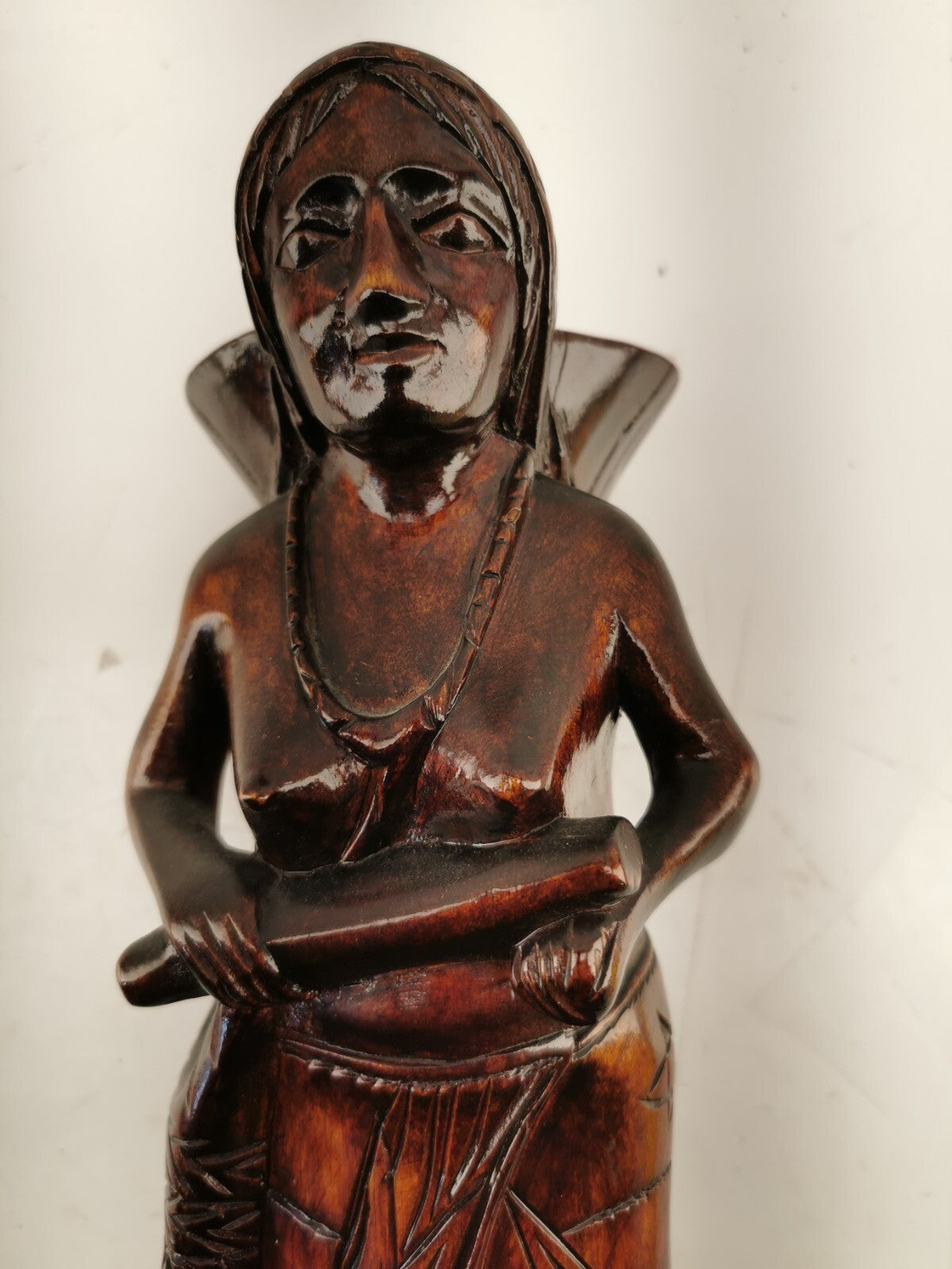 Carving of indigenous woman, carved in noble woods.