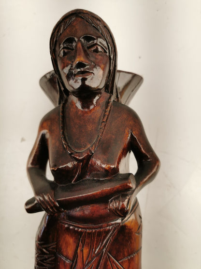 Carving of indigenous woman, carved in noble woods.