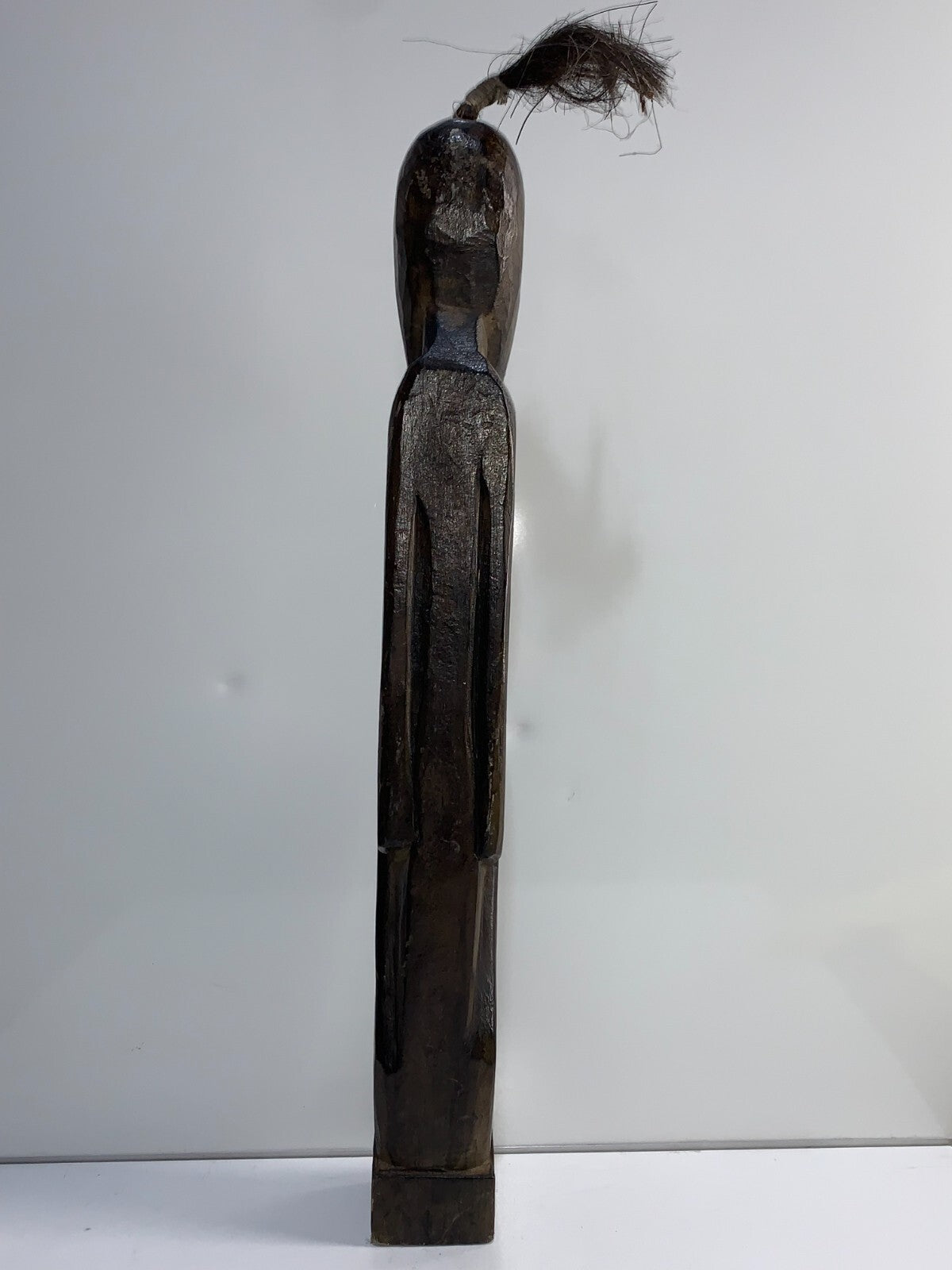 An African Carved Wood Seating Figure