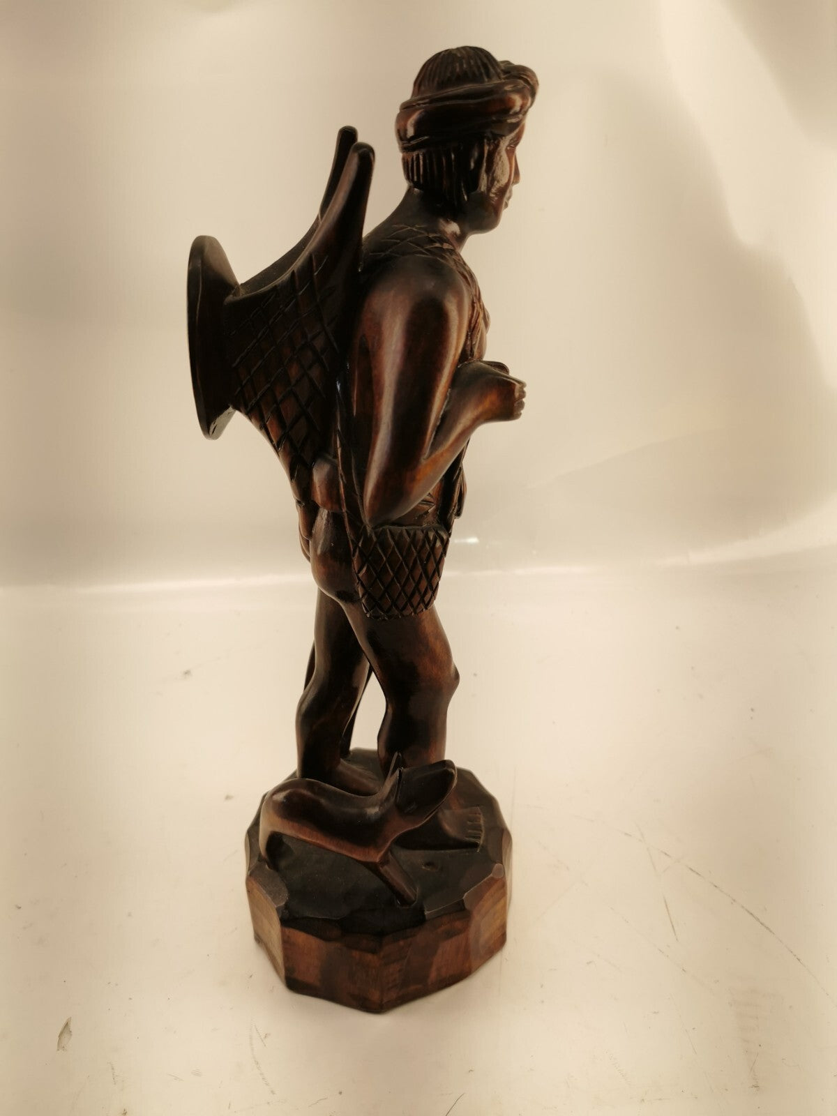 Carving of indigenous man, carved in noble woods.