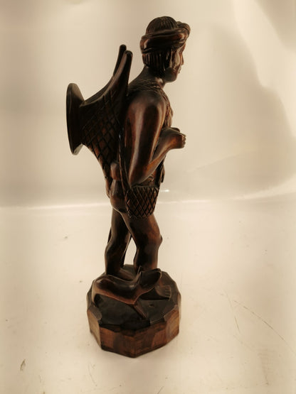 Carving of indigenous man, carved in noble woods.