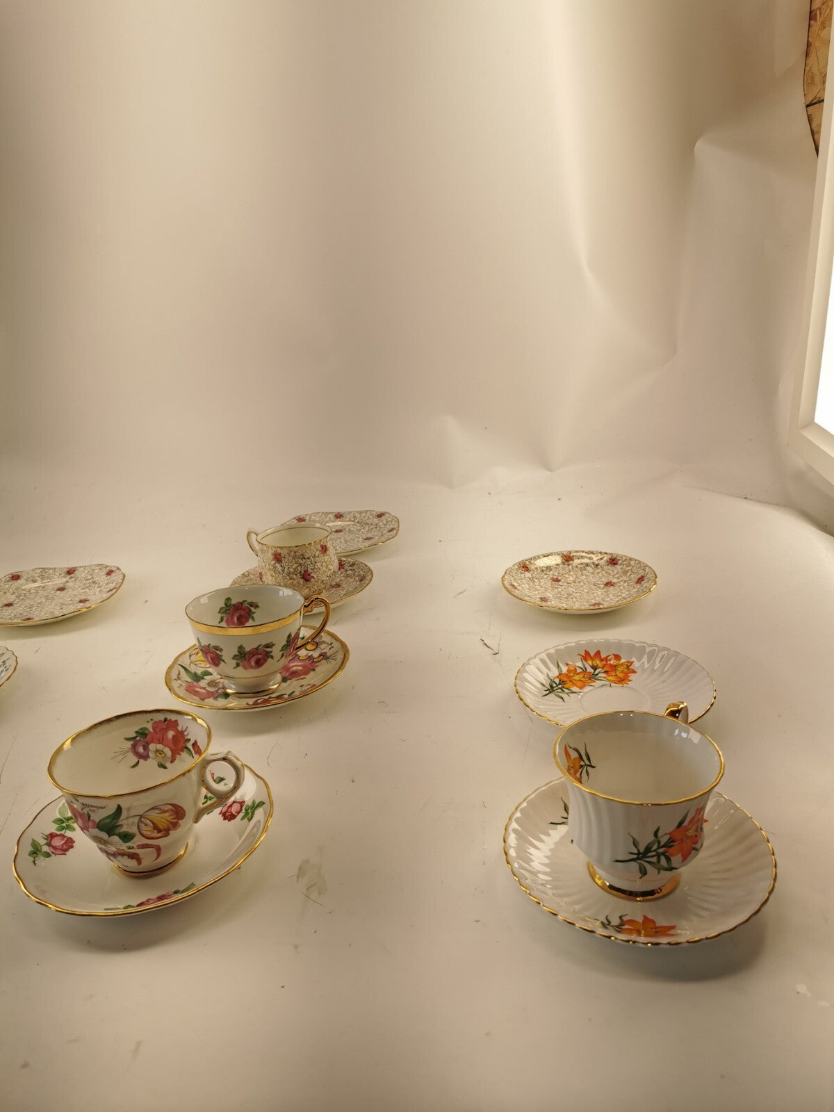 Assorted bone china set 4 cups and 10 saucers. Made in England/Japan/China