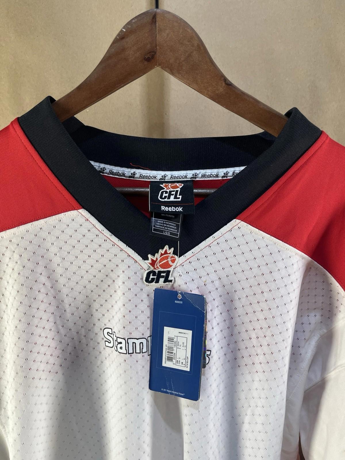 NWT Reebok CFL Calgary Stampeders Jersey Signed by #76 (Size L)
