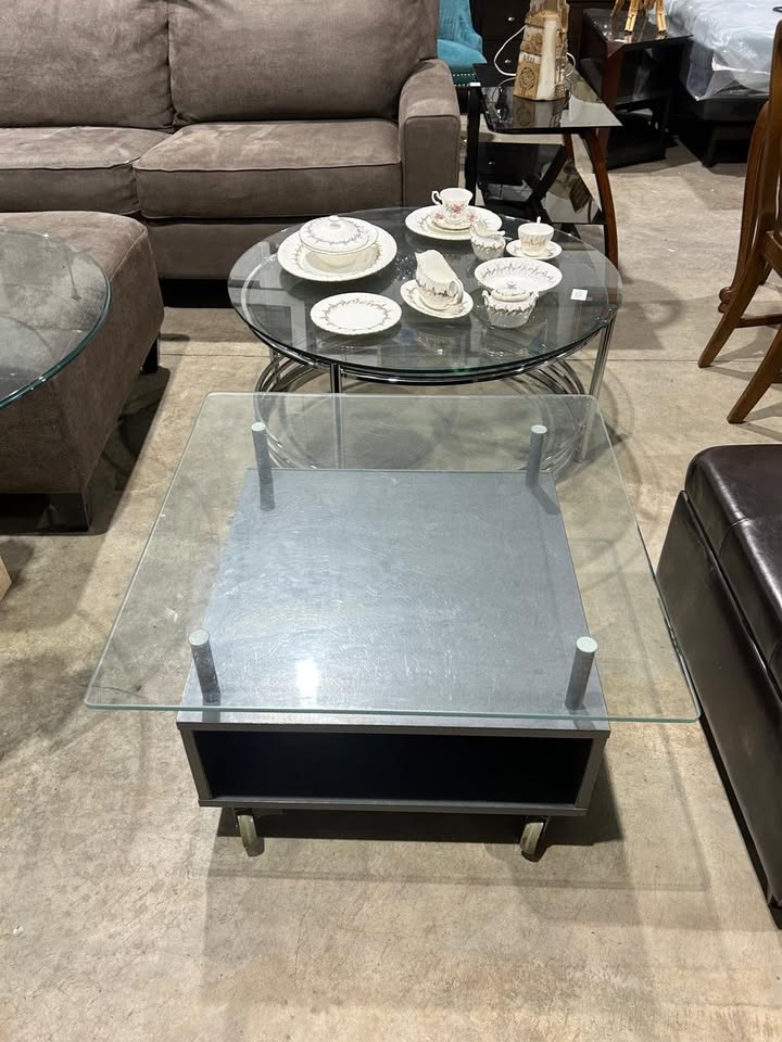 Square glass coffee table on wheels