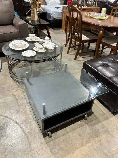 Square glass coffee table on wheels