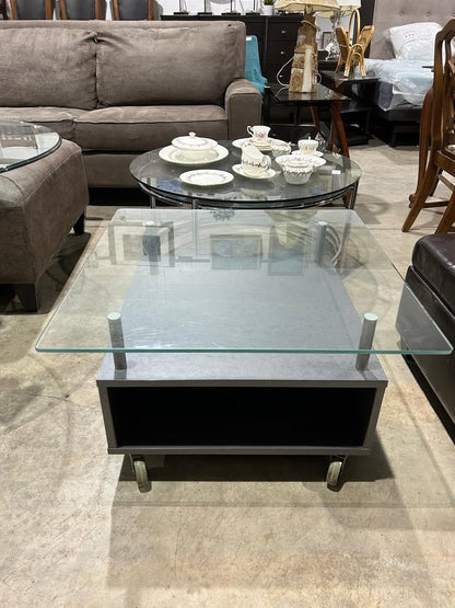 Square glass coffee table on wheels