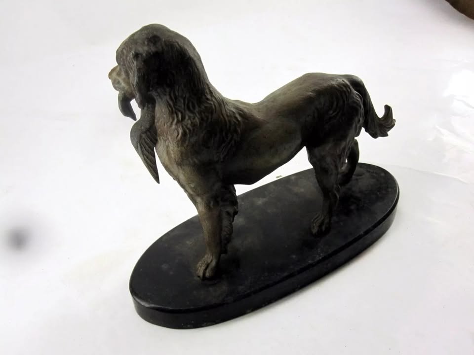 Bronze Dog with Duck Statue on Oval Base – Duck Damage