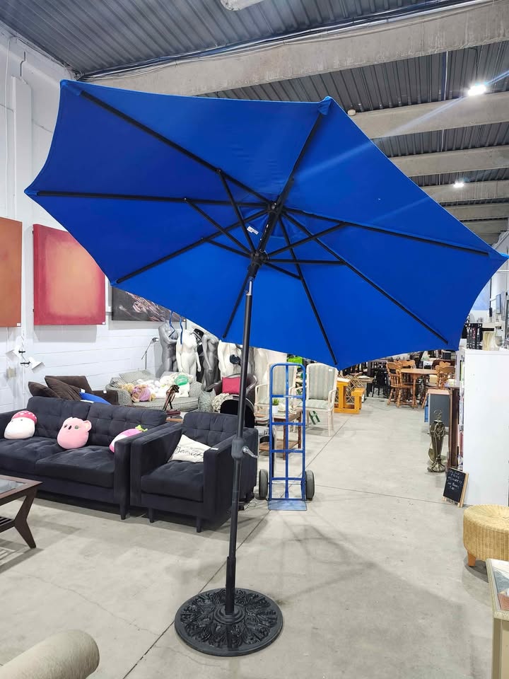 Sunbrella "The Lean" Auto Tilt Patio Umbrella with Stand - 9ft wide