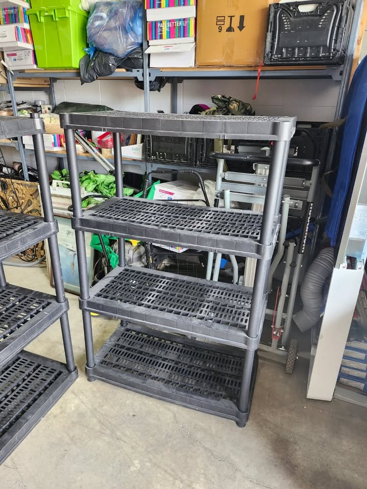Three Black Plastic Adjustable Shelving Racks